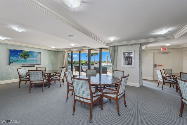 dining area featuring carpet flooring and crown molding