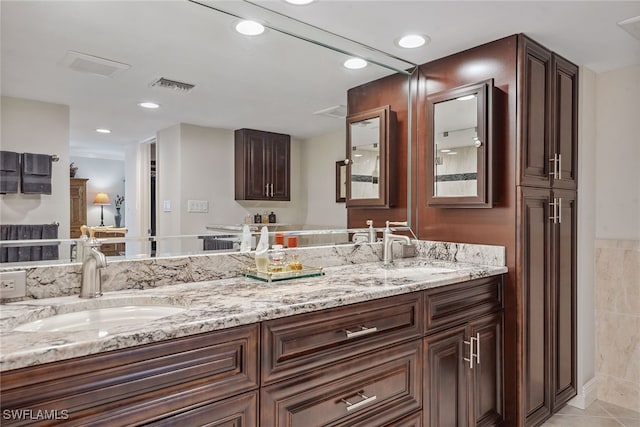 bathroom featuring tile patterned floors and vanity