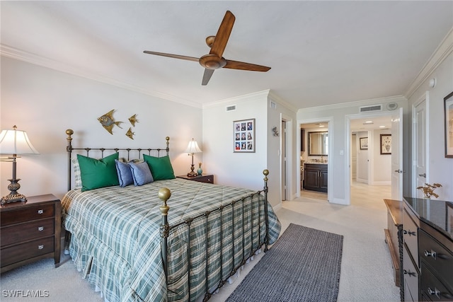 carpeted bedroom featuring ensuite bath, ceiling fan, and ornamental molding