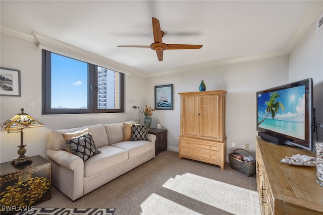 living room featuring light colored carpet, ceiling fan, and ornamental molding