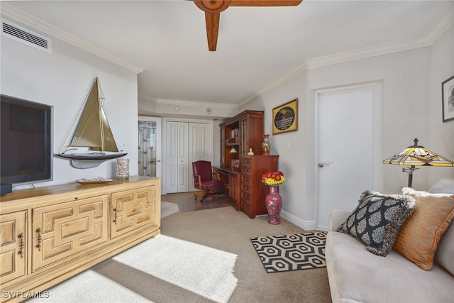 interior space with ceiling fan, ornamental molding, and a closet