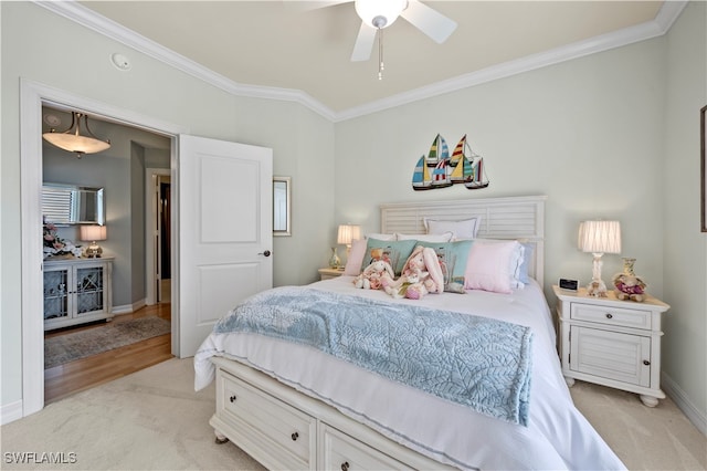 bedroom featuring ceiling fan, light wood-type flooring, and ornamental molding