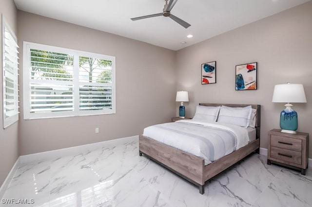 bedroom with marble finish floor, recessed lighting, and baseboards