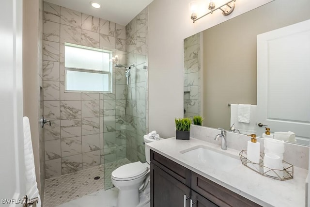 full bathroom featuring a walk in shower, marble finish floor, toilet, and vanity