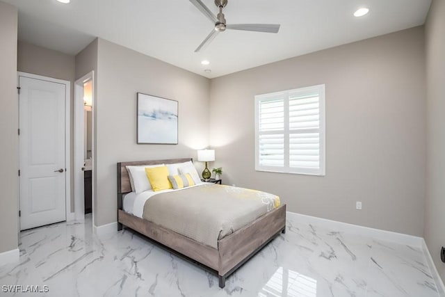 bedroom with marble finish floor, recessed lighting, and baseboards