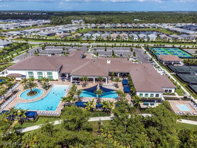 birds eye view of property with a residential view