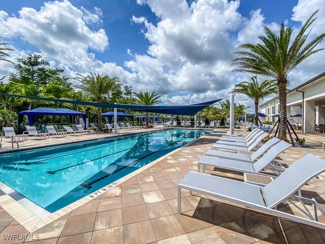 community pool with a patio