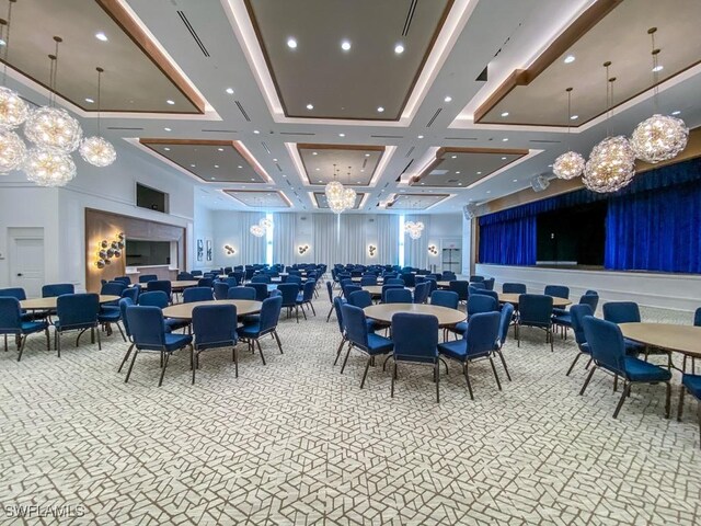 dining space with carpet, a notable chandelier, a high ceiling, and recessed lighting