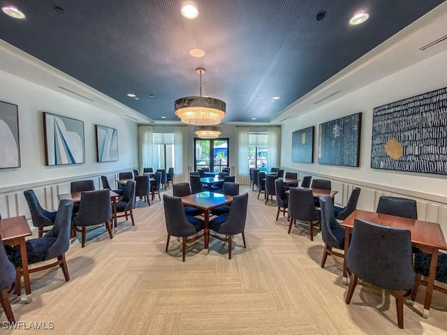 dining area featuring light colored carpet and recessed lighting