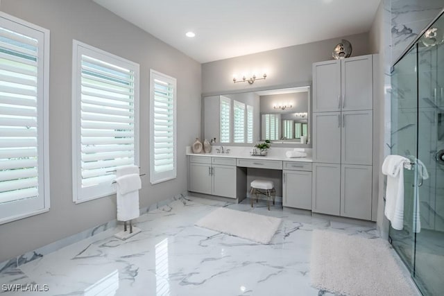 full bathroom featuring marble finish floor, double vanity, recessed lighting, a stall shower, and a sink