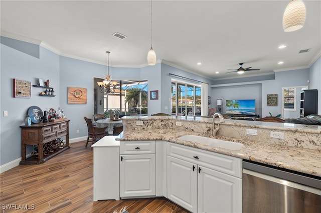 kitchen featuring wood finished floors, a sink, visible vents, open floor plan, and dishwasher