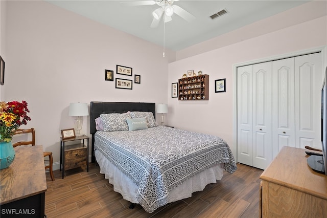 bedroom with ceiling fan, a closet, visible vents, and wood finished floors