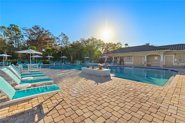 community pool featuring a patio