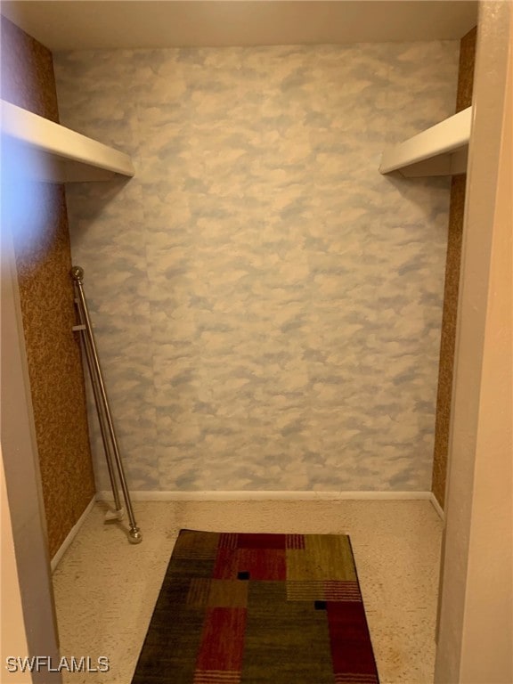 walk in closet featuring carpet