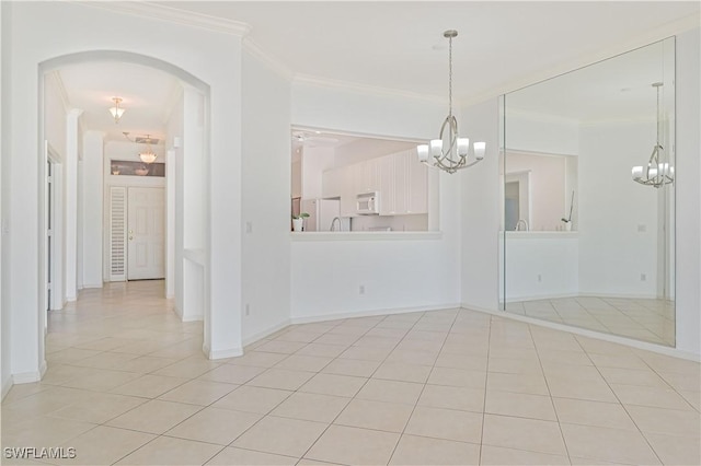 tiled spare room with ornamental molding