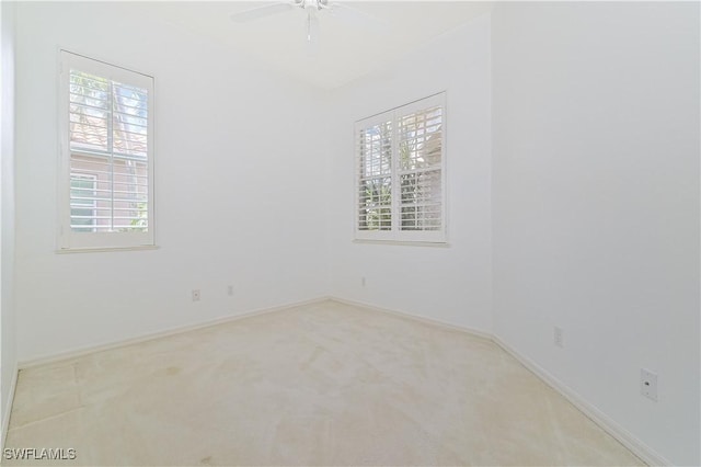 carpeted empty room with ceiling fan