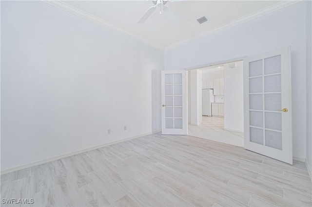 spare room with french doors, light hardwood / wood-style flooring, ceiling fan, and ornamental molding