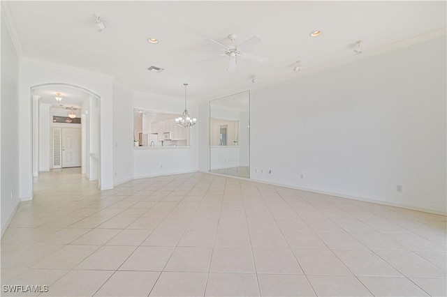 tiled spare room featuring ceiling fan with notable chandelier and ornamental molding