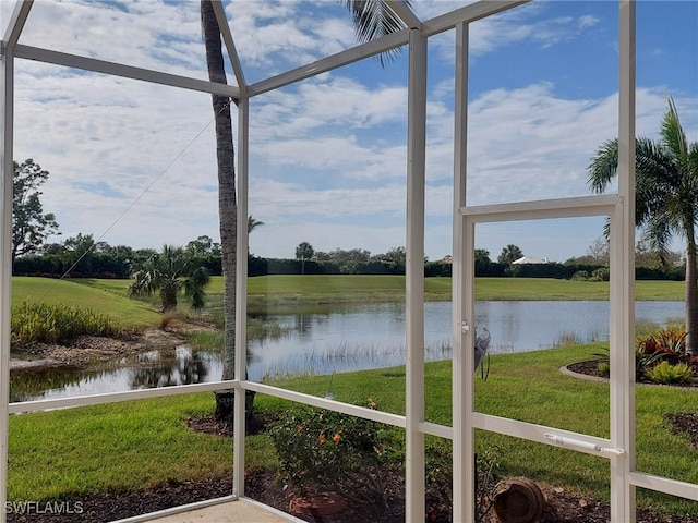 unfurnished sunroom with a water view