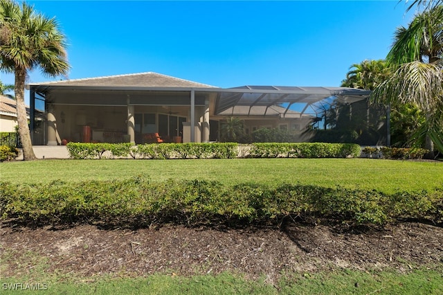 view of yard featuring glass enclosure