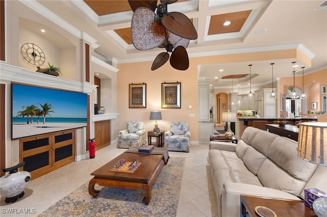 tiled living room with beam ceiling, crown molding, ceiling fan with notable chandelier, and coffered ceiling