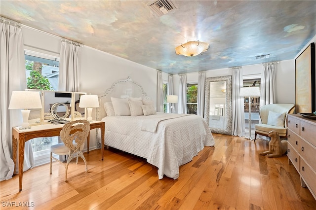 bedroom with light hardwood / wood-style flooring