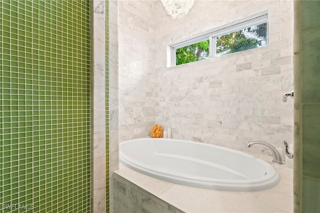 bathroom featuring tiled bath