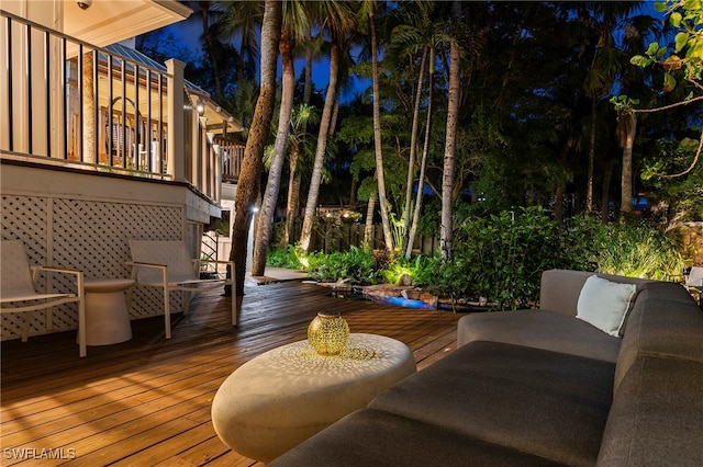 wooden terrace with an outdoor hangout area