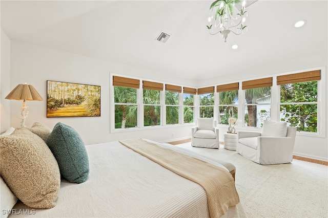 bedroom with a notable chandelier