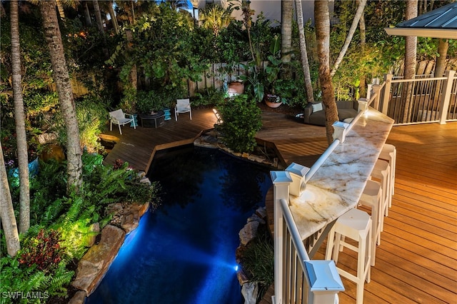 view of swimming pool featuring a wooden deck