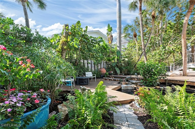 view of property's community featuring a wooden deck