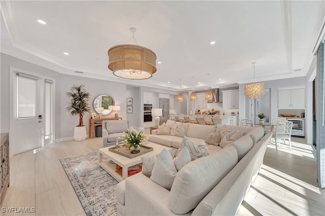 tiled living room featuring a tray ceiling, wine cooler, and a healthy amount of sunlight