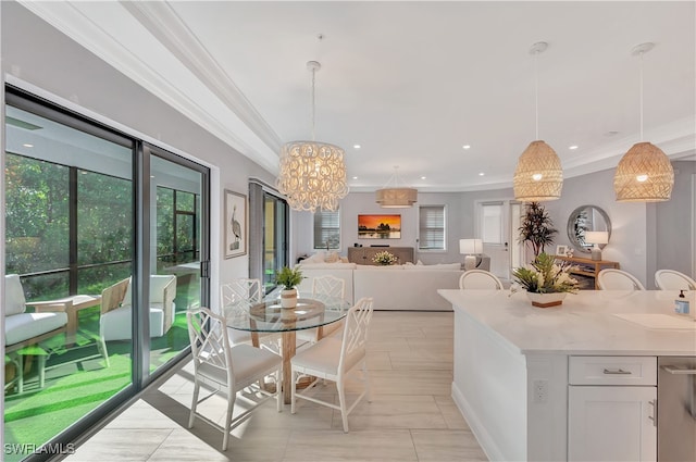 kitchen with crown molding, pendant lighting, light tile patterned floors, an inviting chandelier, and white cabinetry