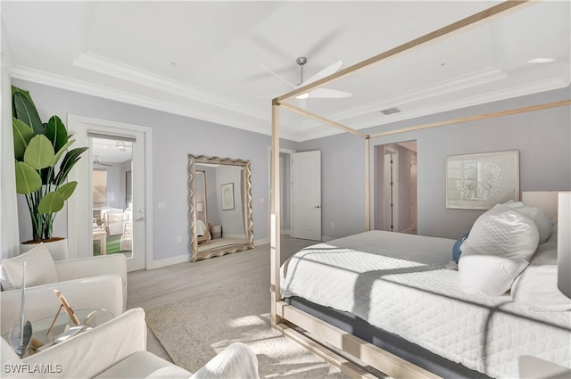 bedroom with ornamental molding and light wood-type flooring