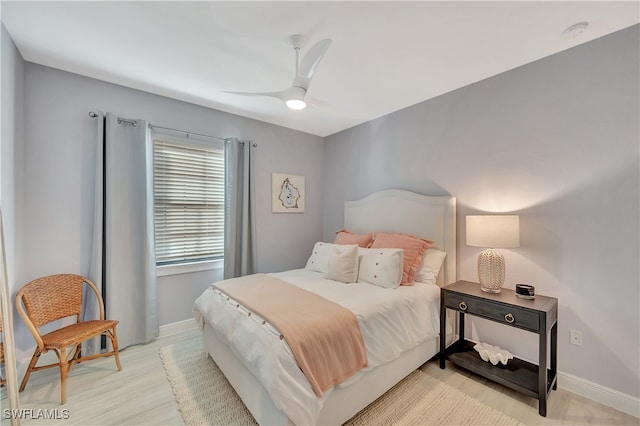 bedroom with ceiling fan and light wood-type flooring