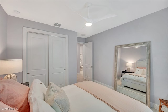 bedroom featuring ceiling fan and a closet