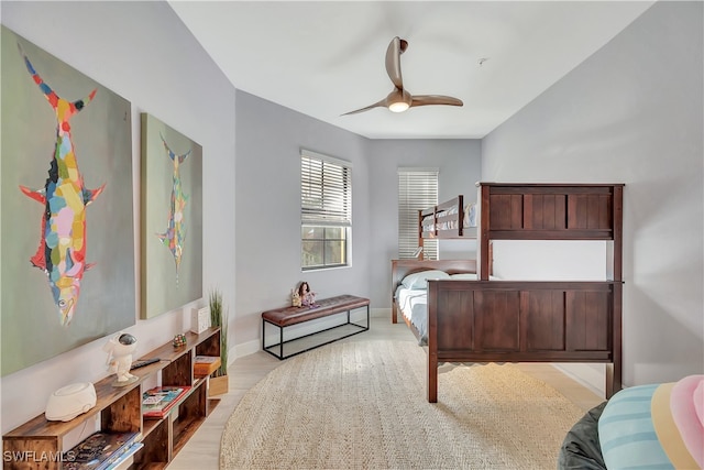 bedroom with light hardwood / wood-style floors and ceiling fan