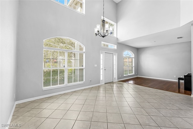 entrance foyer featuring a healthy amount of sunlight and a high ceiling