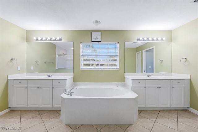 bathroom featuring vanity, tile patterned floors, and separate shower and tub