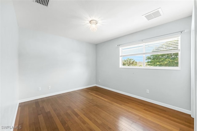 empty room featuring hardwood / wood-style floors