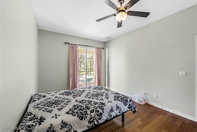 bedroom with ceiling fan and dark hardwood / wood-style floors