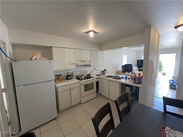 kitchen with white cabinetry, light tile patterned flooring, white appliances, and sink