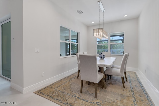 dining space with a notable chandelier