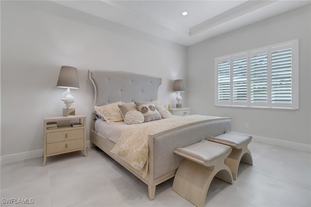 tiled bedroom featuring a raised ceiling and crown molding