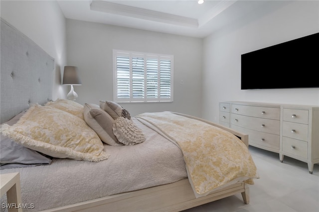 bedroom with a tray ceiling