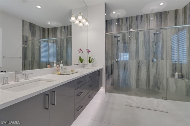 bathroom with tile patterned floors, vanity, and an enclosed shower