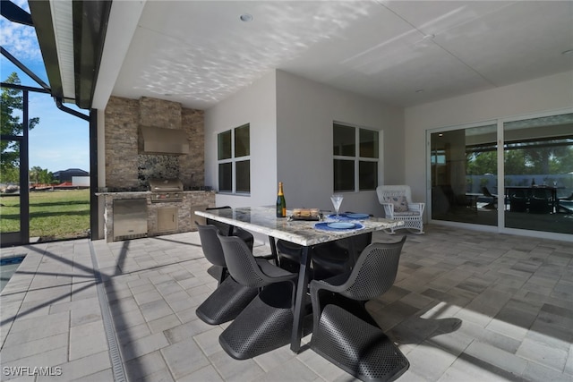 view of patio / terrace featuring grilling area and an outdoor kitchen