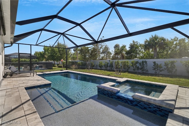 view of swimming pool featuring a lanai, an in ground hot tub, and a patio