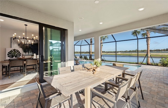 interior space featuring a water view and a notable chandelier