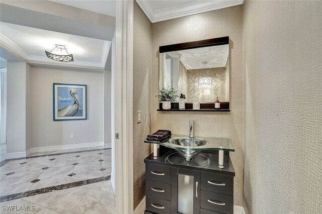 bathroom featuring vanity and ornamental molding